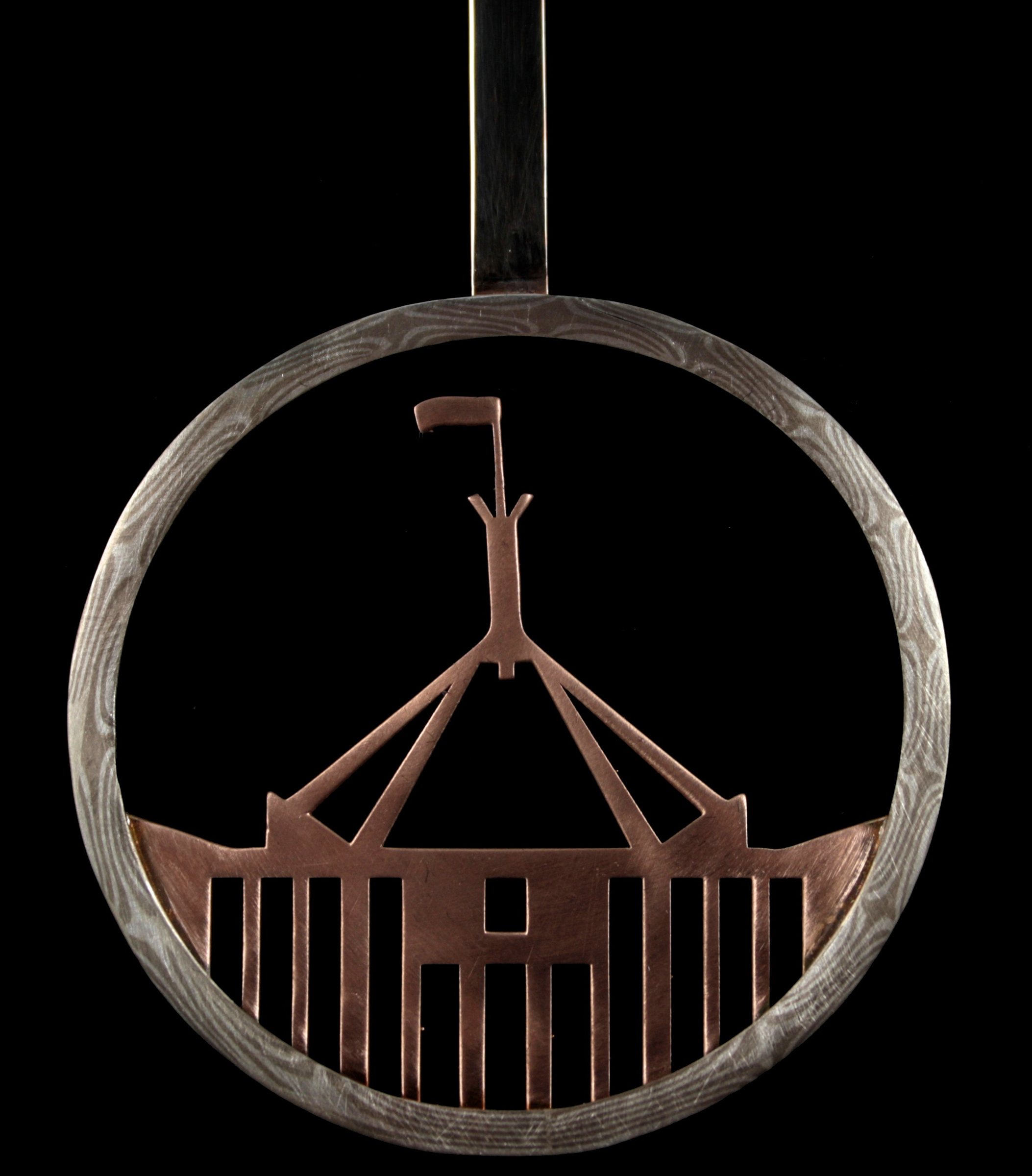 The pendulum: a Mokume Gane ring framing a rose gold silhouette of Parliament House