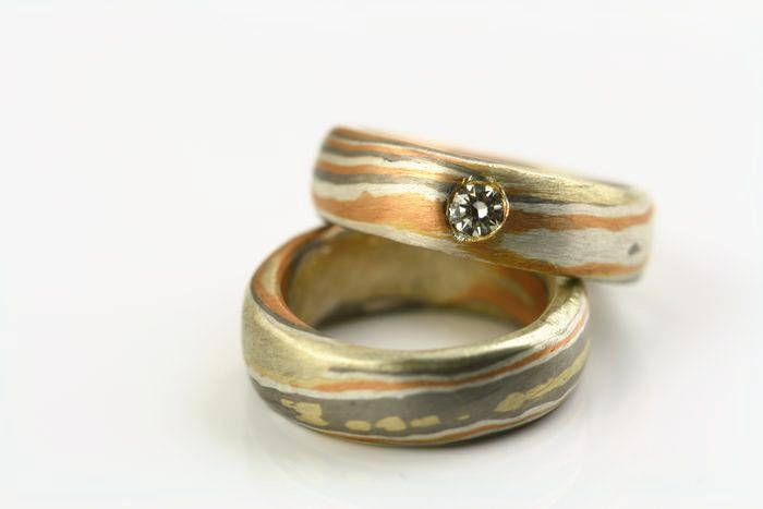Pair of Mokume Gane rings: a pair of Mokume Gane rings with a diamond