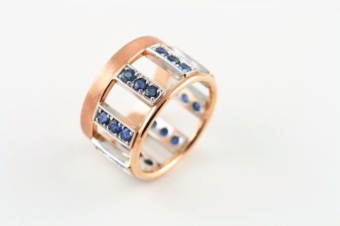 Sapphire cage band: blue Sapphires and diamonds set in 18 karat rose and white gold