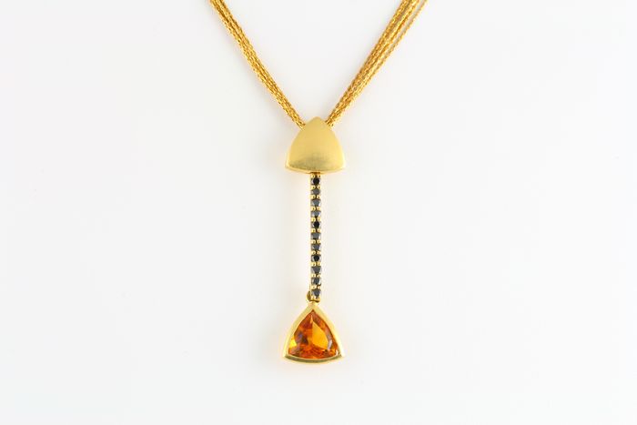 Citrine drop pendant: a Citrine with diamonds in 18 karat yellow gold