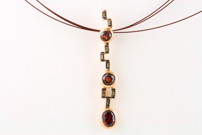 Garnet drop pendant: Garnets set in 18 karat gold