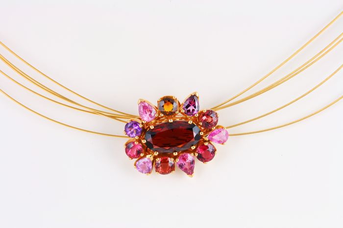 Garnet cluster pendant: Garnet, Citrine, Tourmaline and Amethyst set in 18 karat gold