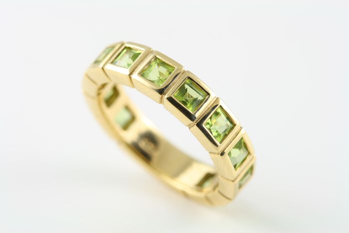 Peridot square band: Peridots set in 18 karat yellow gold