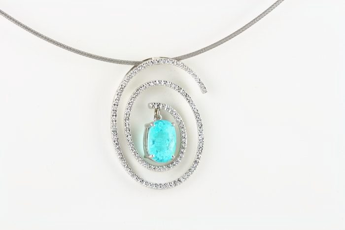 Paraiba Tourmaline spiral pendant: a Paraiba Tourmaline with diamonds in 18 karat white gold