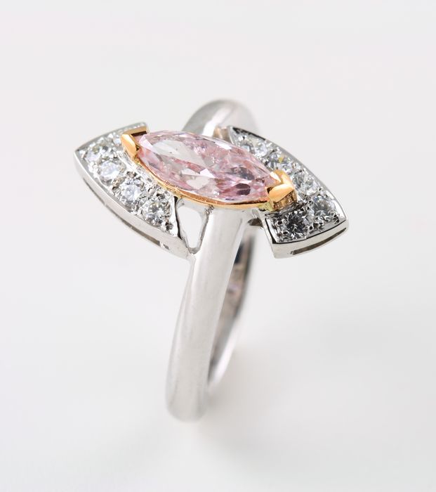 Pink diamond marquise ring: a brownish pink diamond with diamonds in 18 karat white and rose gold