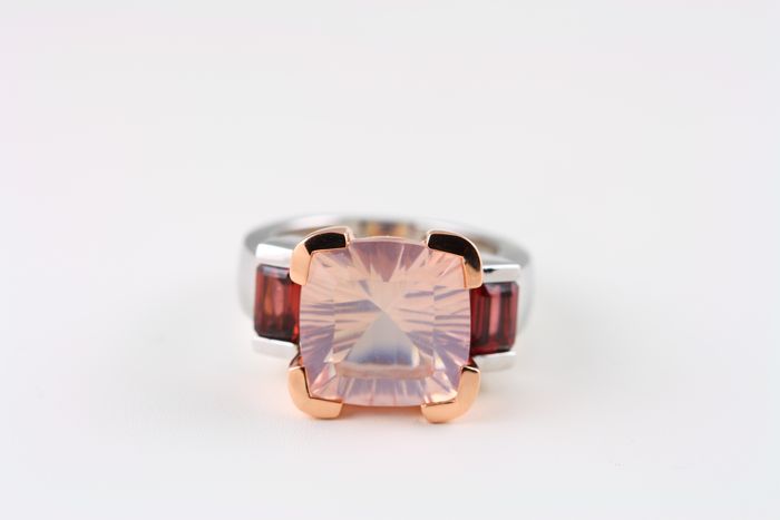 Rose Quartz cushion ring: a Rose Quartz with Garnets in 18 karat rose gold