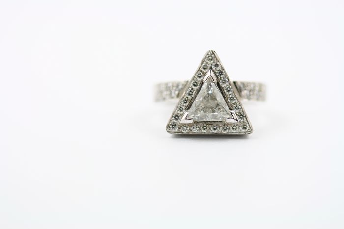 Diamond triangle ring: diamonds set in 18 karat white gold