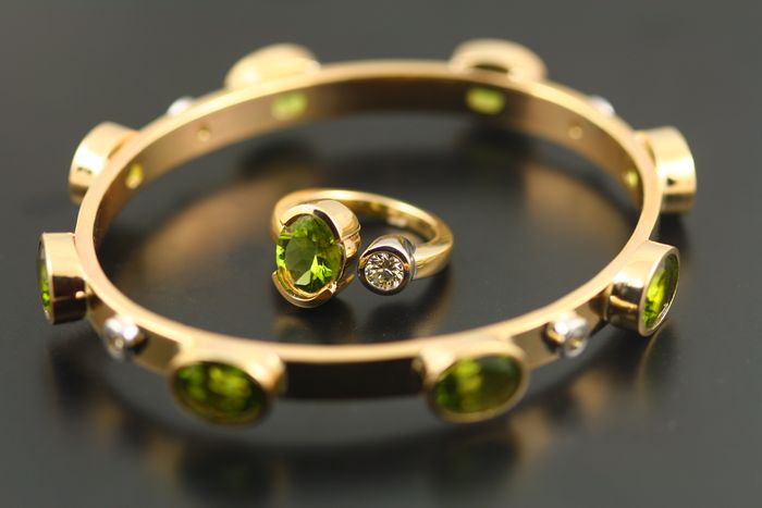 Peridot bangle: Peridots and diamonds set in 18 karat yellow gold