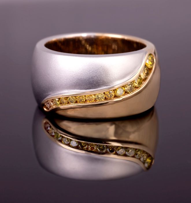 Wave band: yellow diamonds set in an 18 karat white gold and 18 karat rose gold band