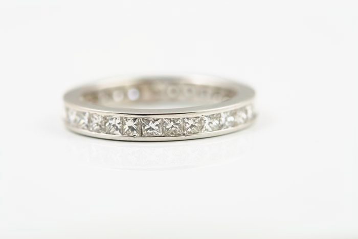 Princess cut diamond eternity ring: princess cut diamonds set in 18 karat white gold