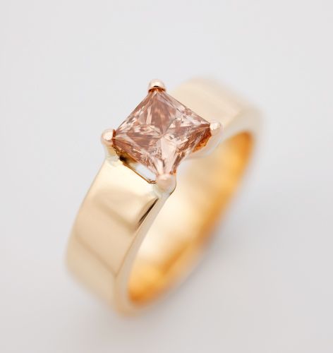 Princess cut champagne diamond ring: a champagne diamond set in 18 karat rose gold