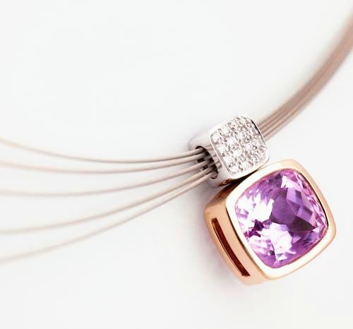 Amethyst cushion pendant: an Amethyst with diamonds in 18 karat rose gold