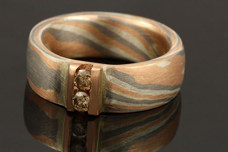 Champagne diamond Mokume Gane band: champagne diamonds channel set in a Mokume Gane band
