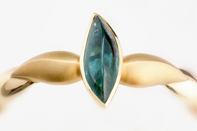Indicolite Tourmaline twist bracelet: an Indicolite Tourmaline set in matte finished 18 karat yellow gold