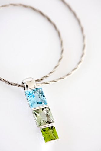 Topaz stack pendant: a blue Topaz with green Amethyst and Peridot in 18 karat white gold
