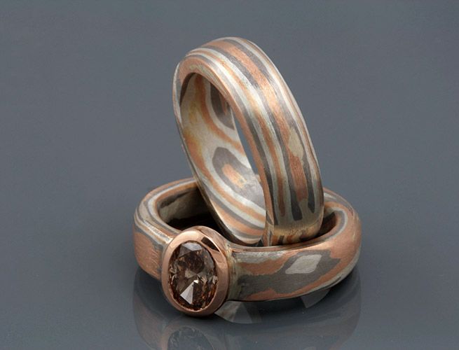 Pair of Mokume Gane rings: a pair of Mokume Gane rings with a champagne diamond