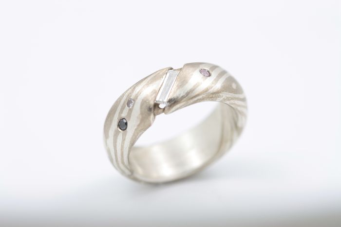 Baguette diamond Mokume Gane ring: a baguette diamond set in a Mokume Gane ring