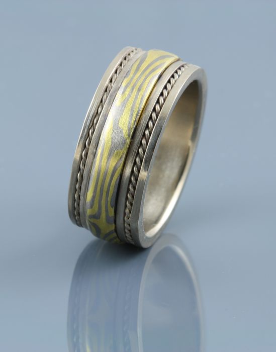 Rope-edge Mokume Gane band: a Mokume Gane band with 18 karat gold