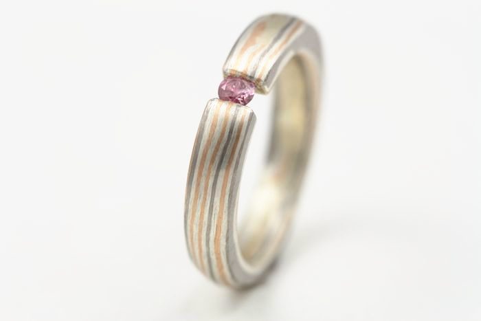 Pink Sapphire Mokume Gane ring: a pink Sapphire set in a Mokume Gane ring