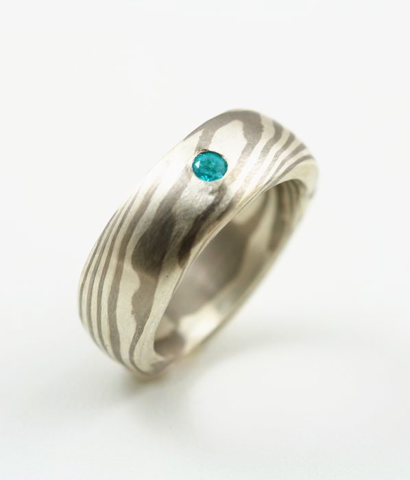 Paraiba Tourmaline Mokume Gane ring: a Paraiba Tourmaline set in a Mokume Gane ring