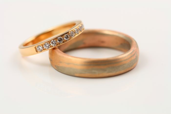 Pair of Mokume Gane rings: Mokume Gane and rose gold rings with diamonds