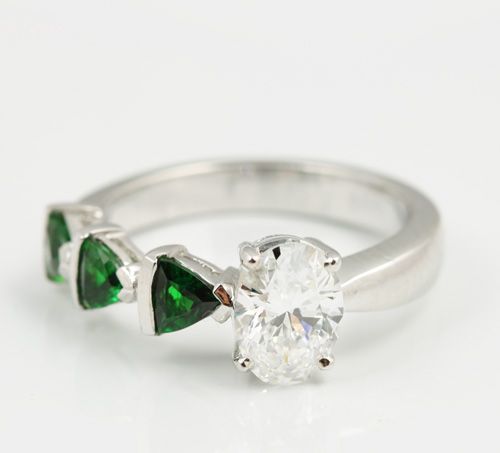 Tsavorite and diamond ring: Tsavorites and a diamond set in 18 karat white gold