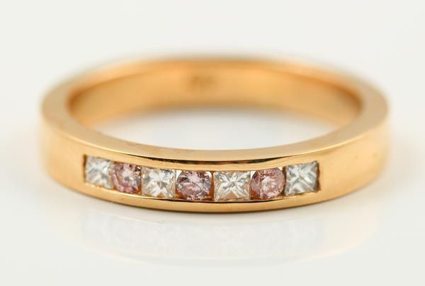 Pink diamond channel band: pink diamonds set in 18 karat rose gold