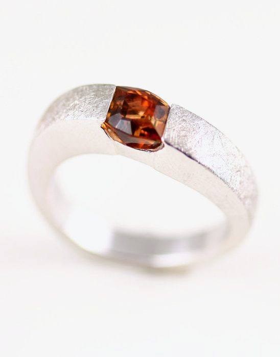 Sunset Tourmaline cushion ring: a Sunset Tourmaline set in 18 karat white gold