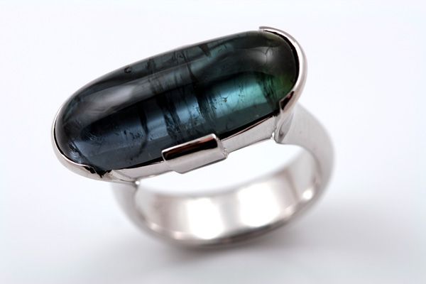 Tourmaline cabochon ring: a green Tourmaline set in 18 karat white gold