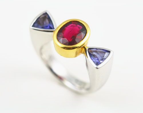 Rubellite Tourmaline open ring: a Rubellite Tourmaline with Iolites in 18 karat white gold