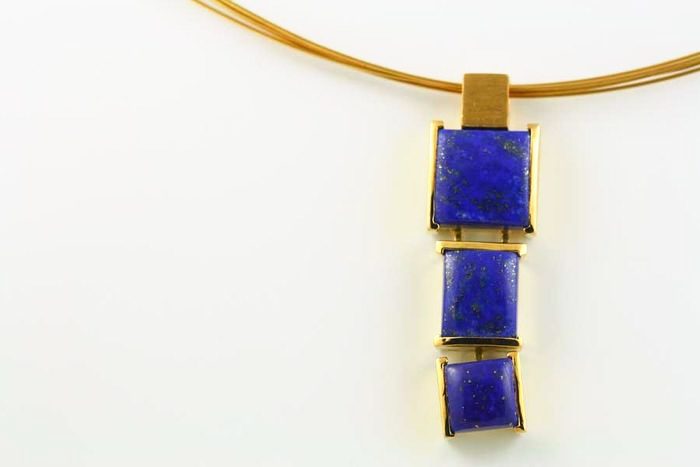 Lapis Lazuli pendant: Lapis Lazuli set in 18 karat yellow gold