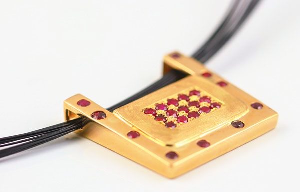 Ruby square pendant: Rubies set in 18 karat yellow gold
