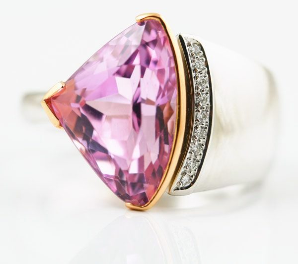 Kunzite trillion ring: a Kunzite with diamonds in 18 karat white gold