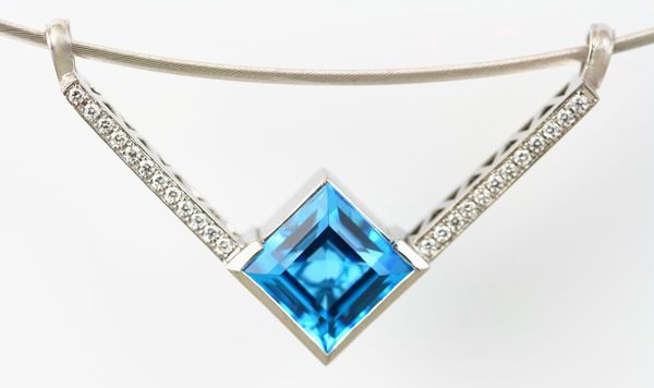 Topaz V pendant: a blue Topaz with diamonds in 18 karat white gold
