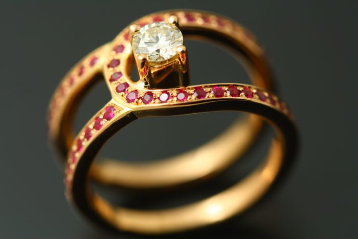 Ruby and diamond band: Rubies and a diamond set in 18 karat rose gold