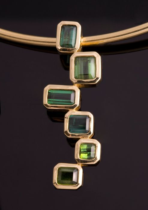 Tourmaline cascade pendant: green Tourmalines set in 18 karat yellow gold